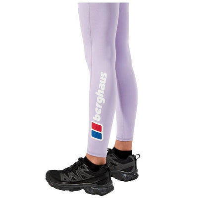 Light purple leggings with a logo on the side are worn with black athletic shoes, suggesting a focus on activewear suitable for exercise or outdoor activities.